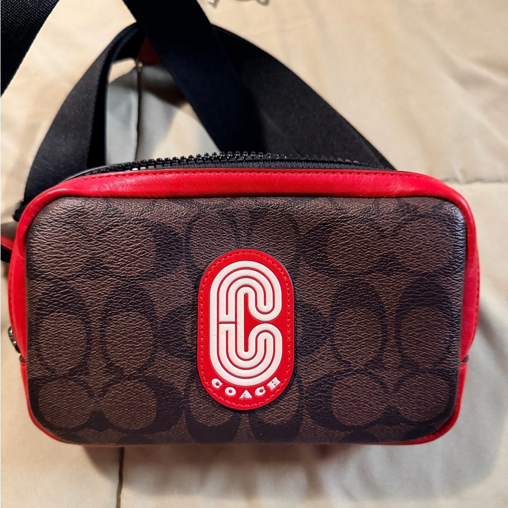 Coach Carrier Phone Crossbody in Colorblock Signature Canvas with Coach Patch.